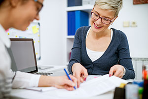 Instructor helping a teacher with training