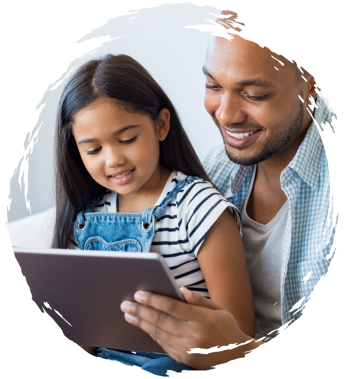 Father reading to their pre-school daughter